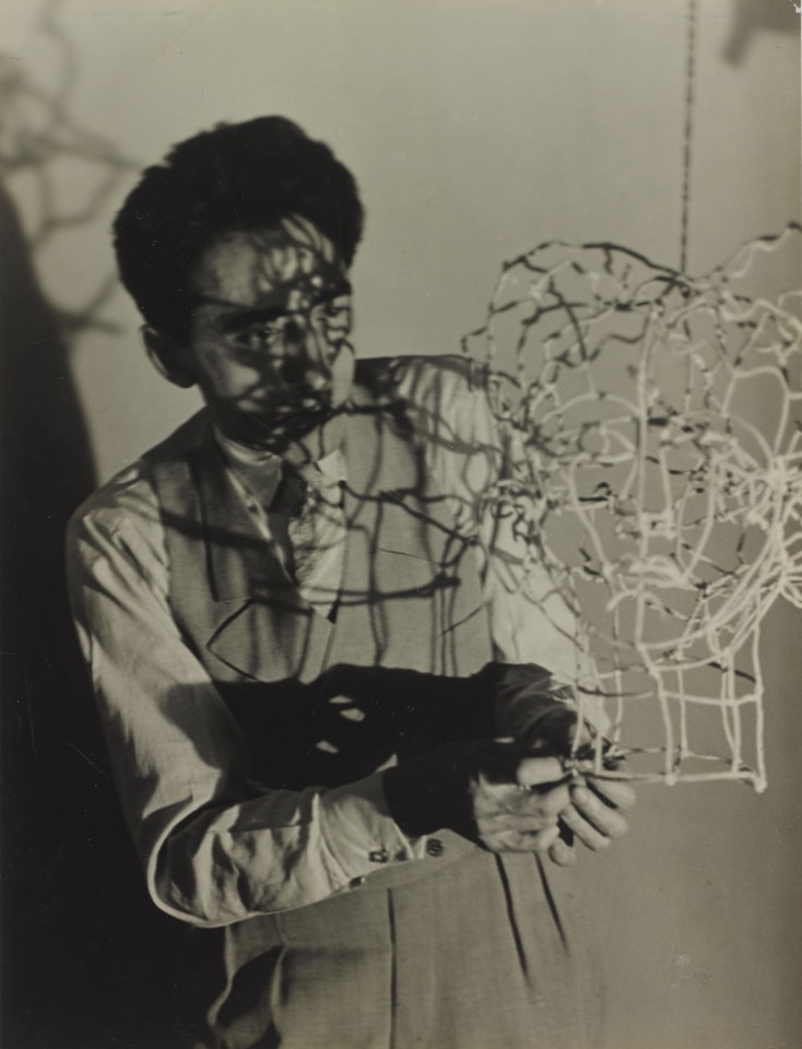 JEAN COCTEAU AND WIRE SCULPTURE by Man Ray