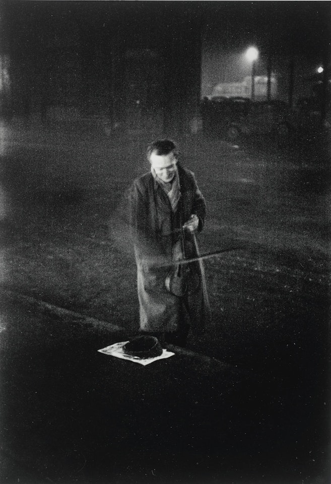 LONDON' (NEAR VICTORIA STATION, STREET MUSICIAN) by Robert Frank