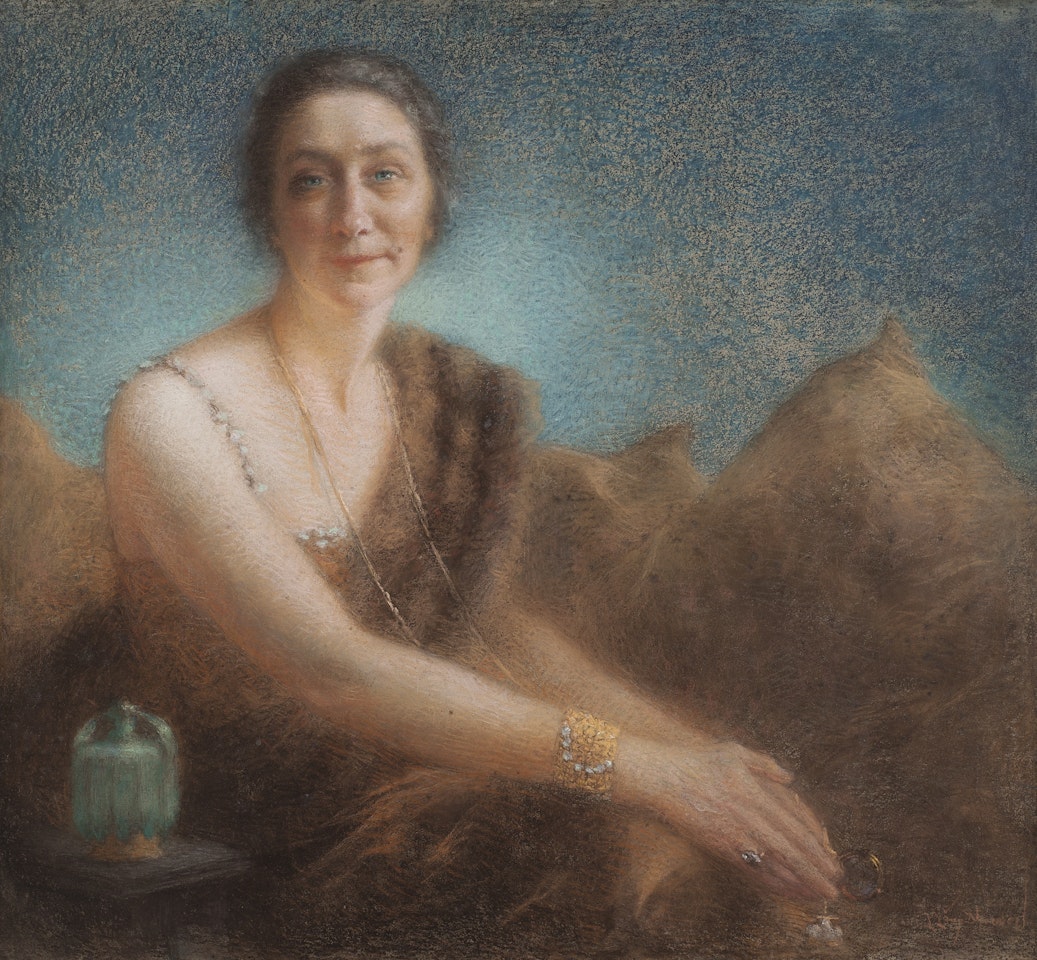 ELEGANT WOMAN ON A SOFA by Lucien Lévy-Dhurmer