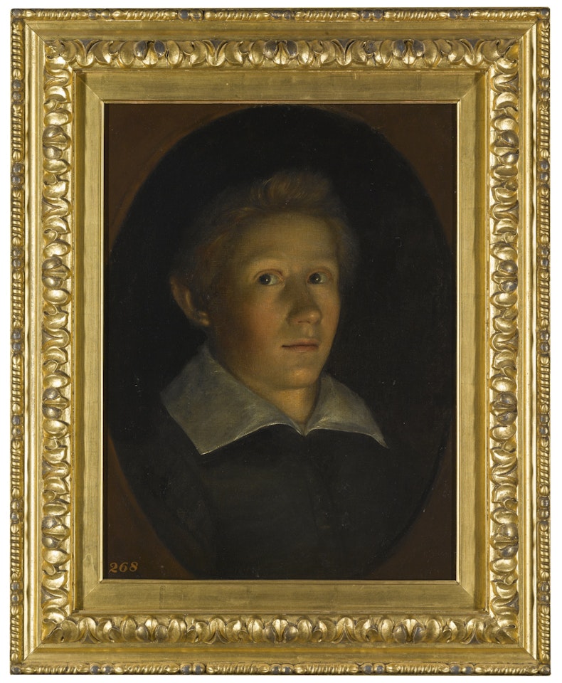 PORTRAIT OF A BOY BY CANDLE LIGHT by Dutch School