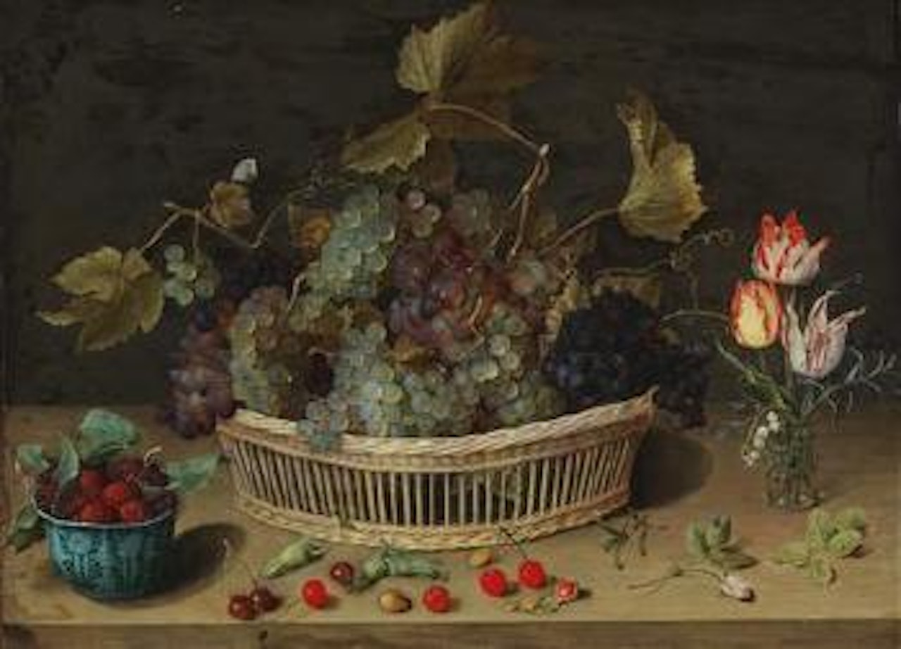 A still life of fruit and flowers with grapes in a wicker basket, blackberries in a porcelain bowl and tulips in a glass vase on the right by Isaak Soreau