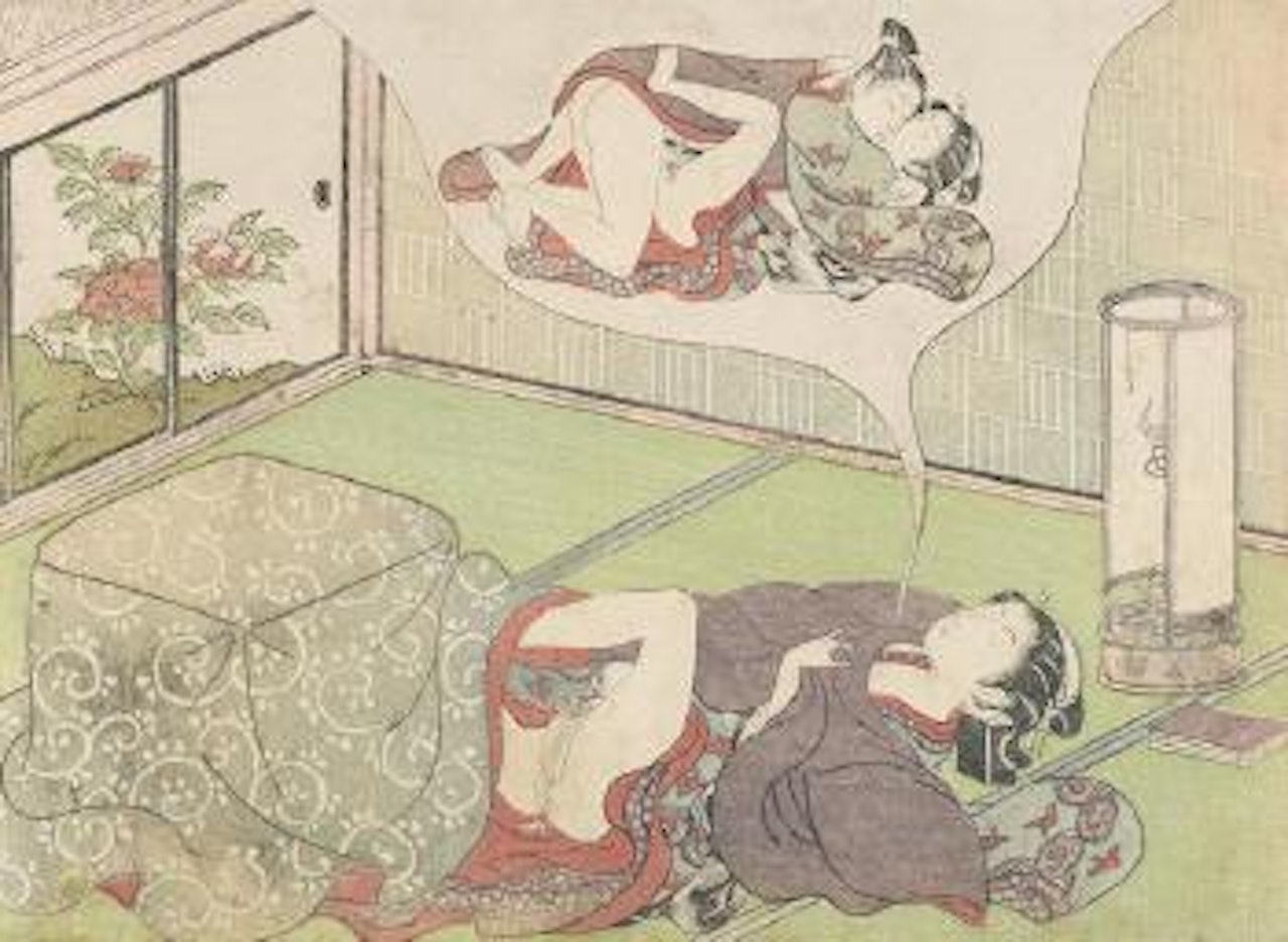 An interior scene depicting a beauty leaning back from a kotatsu and engaged in pleasurable pursuits while thinking of her lover's amorous embrace by Suzuki Harunobu
