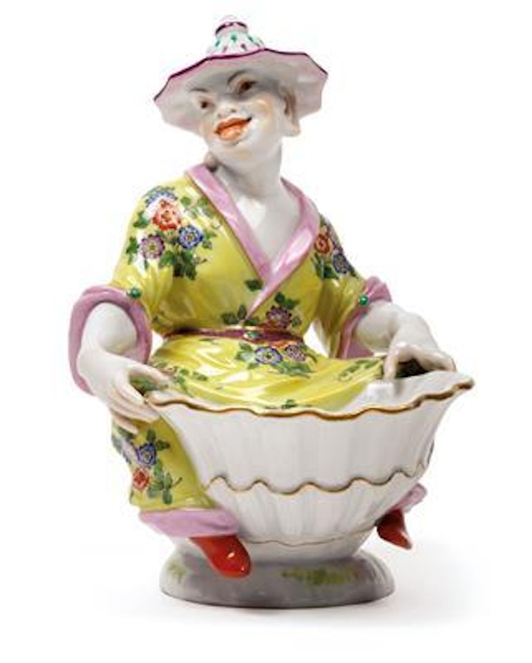 A seated Chinese figure holding a shellwork bowl by Johann Joachim Kändler