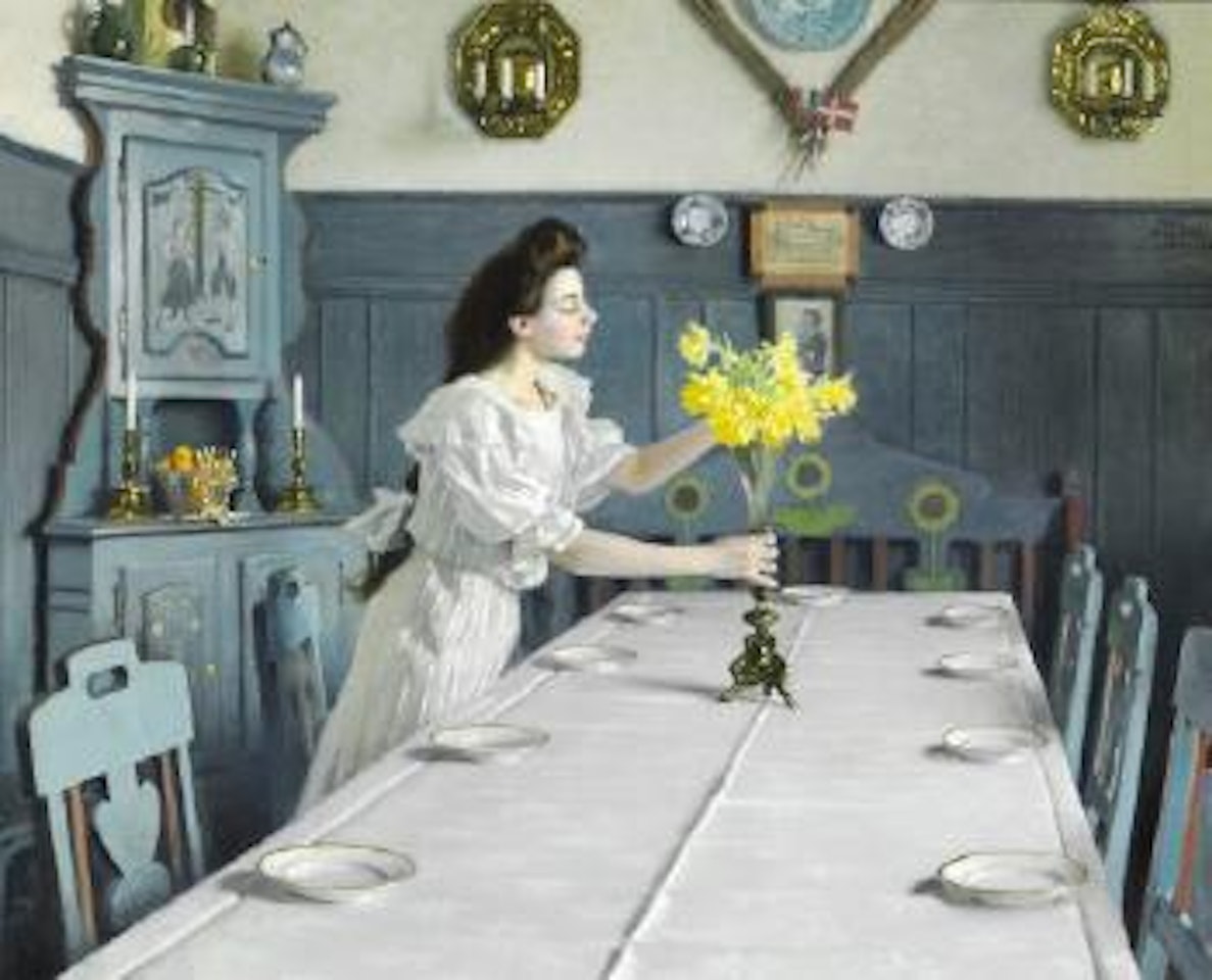 Fødselsdag. The birthday. The painter's daughter Harriet arranging daffodils in a vase on the table by Paul Fischer