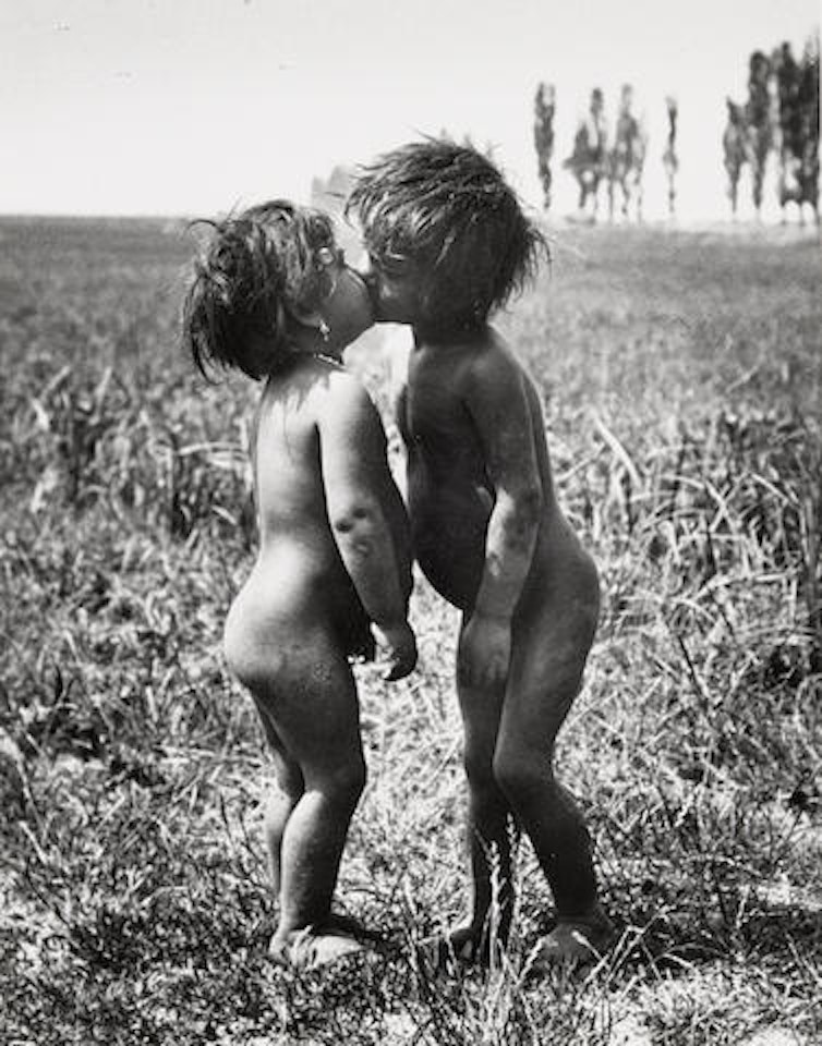 Gypsy Children Kissing, Esztergom, Hungary by André Kertész