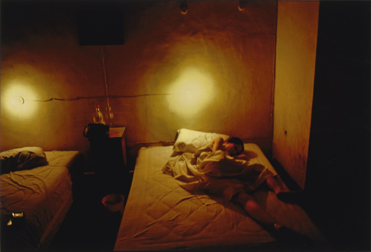SUZANNE IN THE YELLOW HOTEL ROOM, HOTEL SEVILLE, MERIDA, MEXICO, 1981 by Nan Goldin