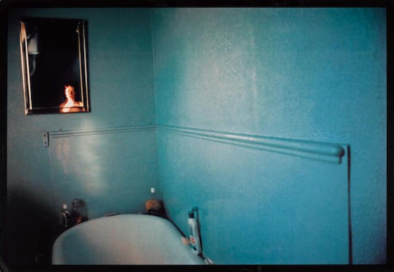 Self Portrait in Blue Bathroom, London by Nan Goldin