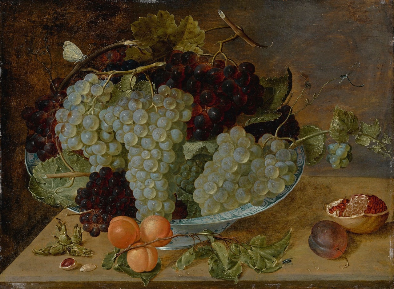 STILL LIFE OF GRAPES, PEACHES, AND A POMEGRANATE ON STONE LEDGE by Isaak Soreau