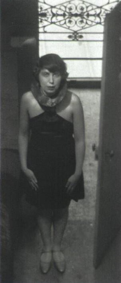 Magda Forstner in the door of Etienne Beothy's studio by André Kertész