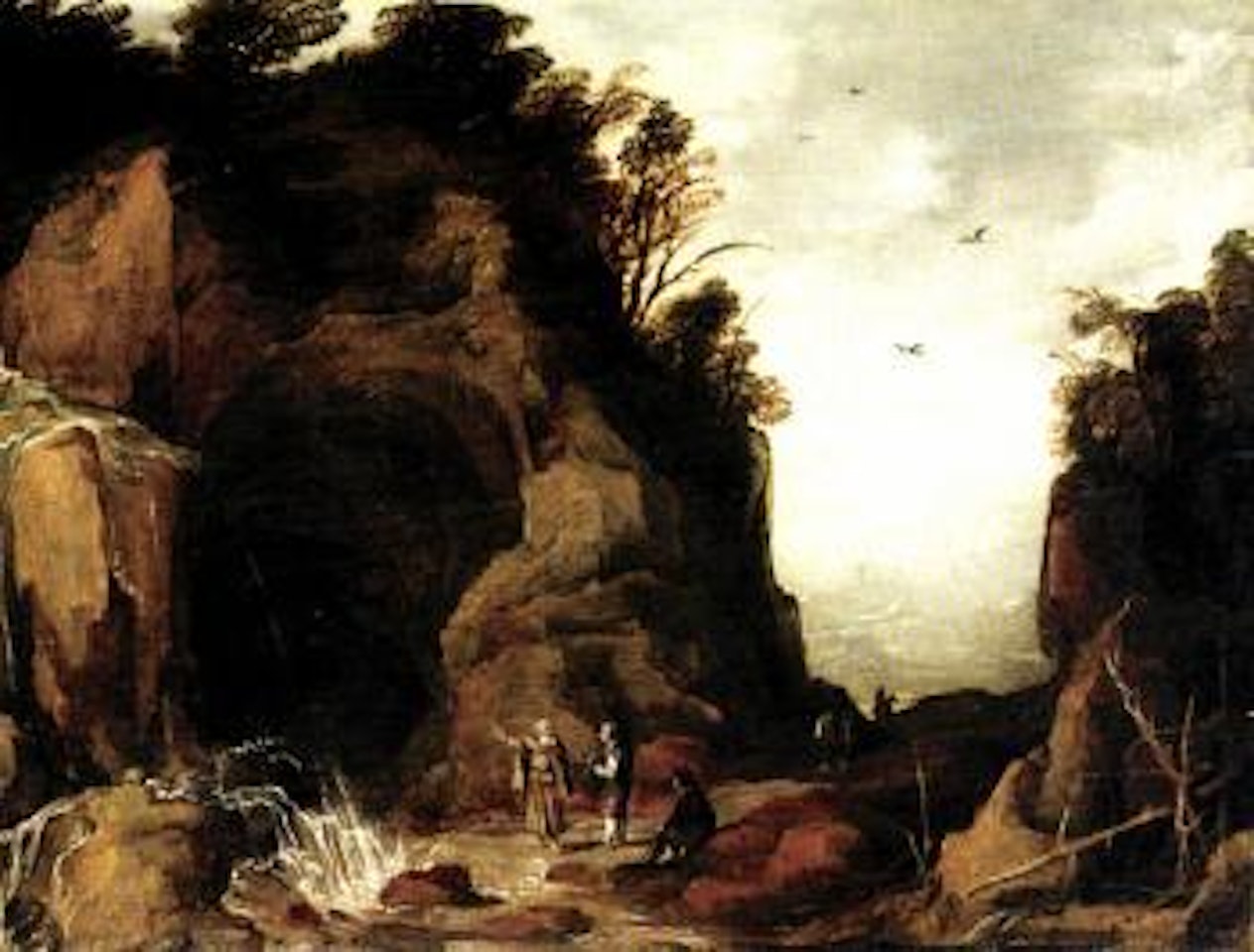 Mountainous landscape with travellers and a hermit outside a cave by Joos de Momper the Younger