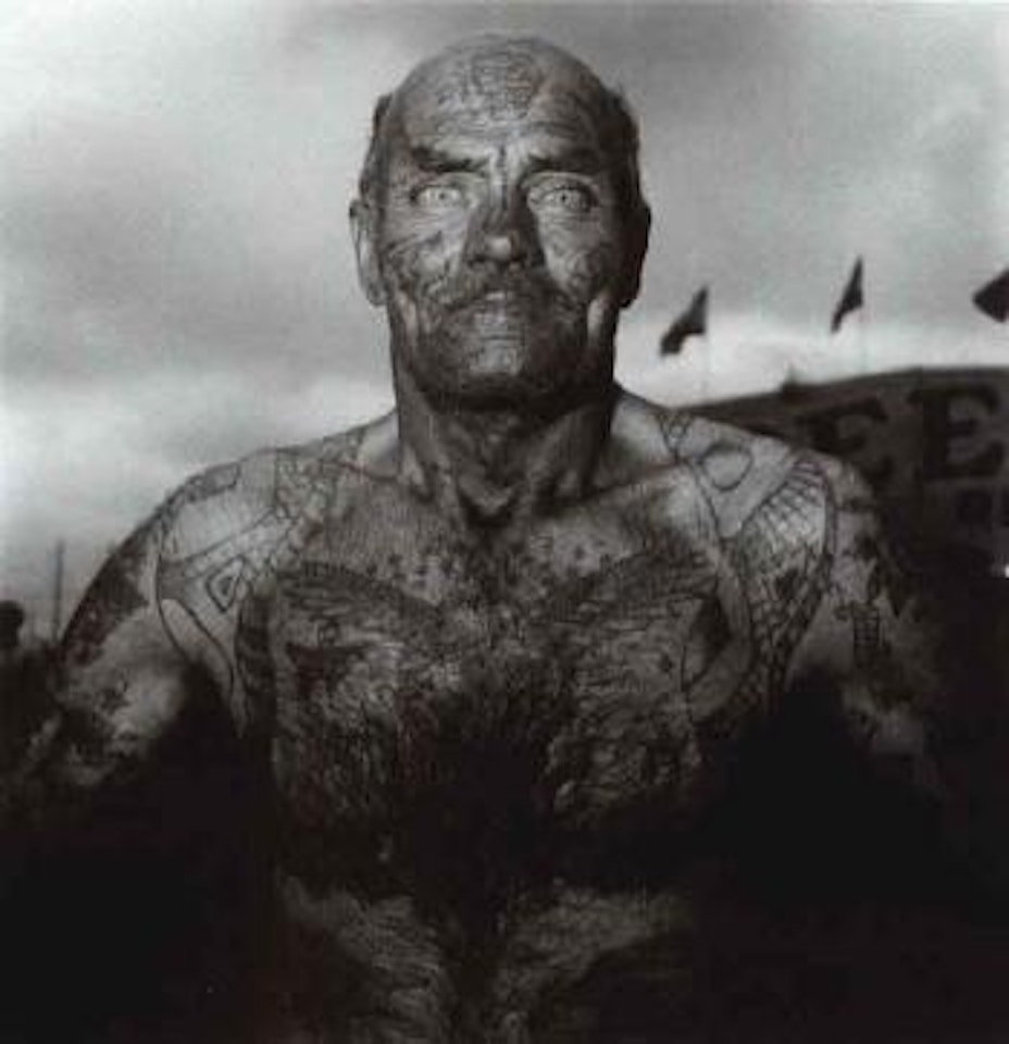 Tattooed man at a carnival, MD by Diane Arbus by Neil Selkirk
