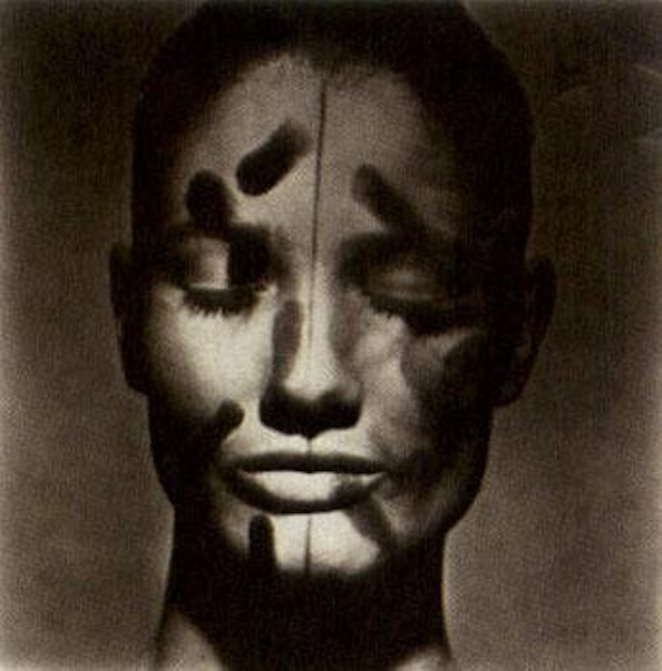 Vogue beauty head with eyes closed, front view, New York by Irving Penn