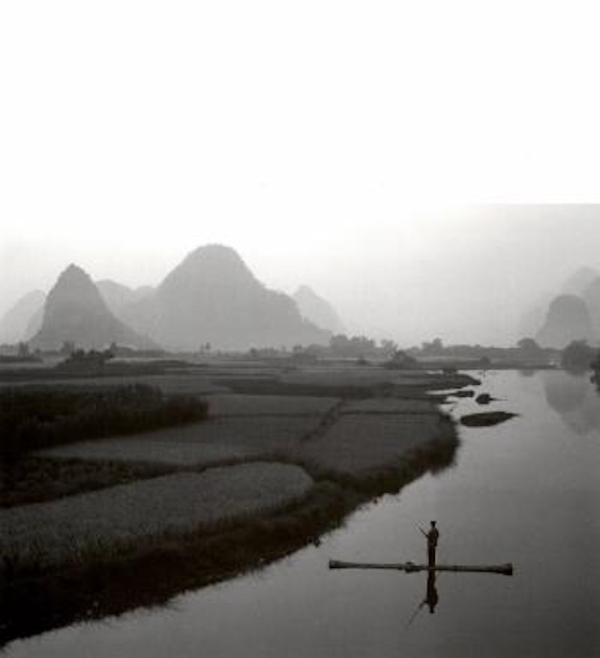 Bamboo raft on Yu Long river by Russel Wong