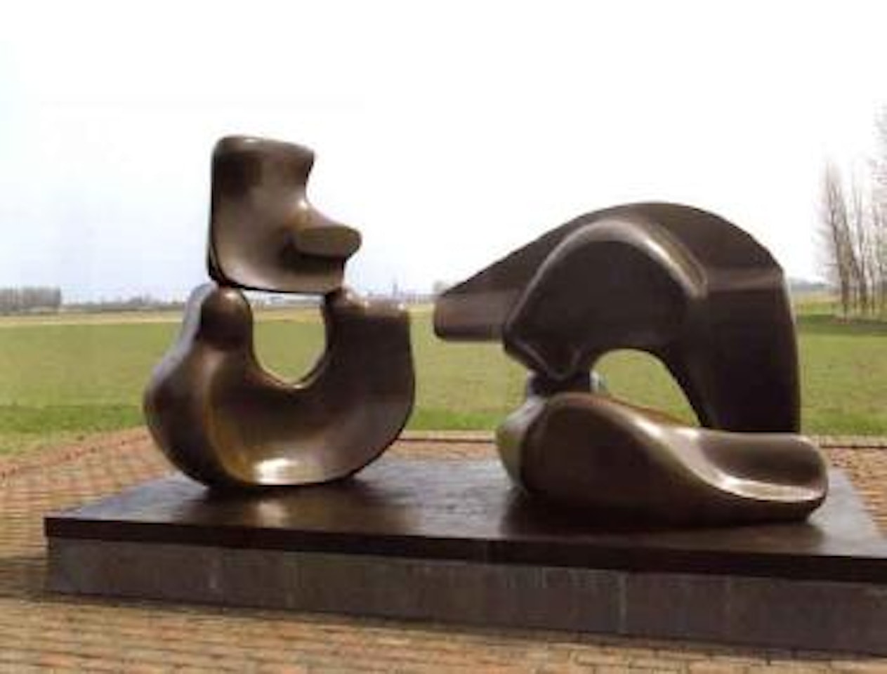 Large four piece reclining figure by Henry Moore