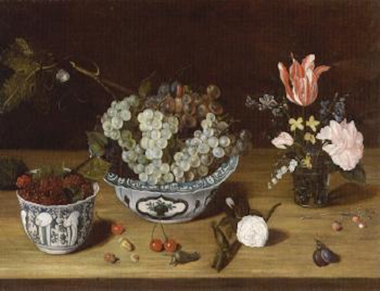 Still life of flowers with grapes and blackberries by Isaak Soreau