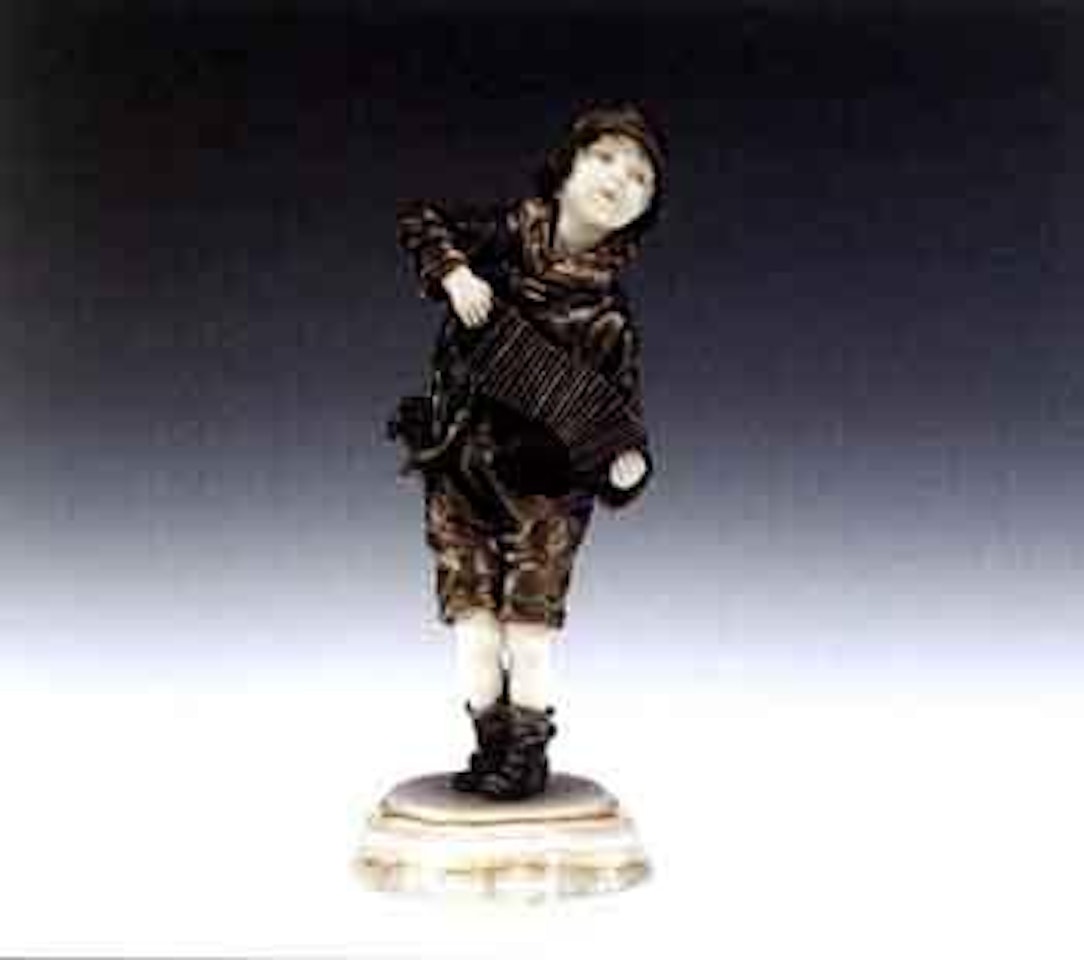 Young boy playing the bango by Demetre Chiparus
