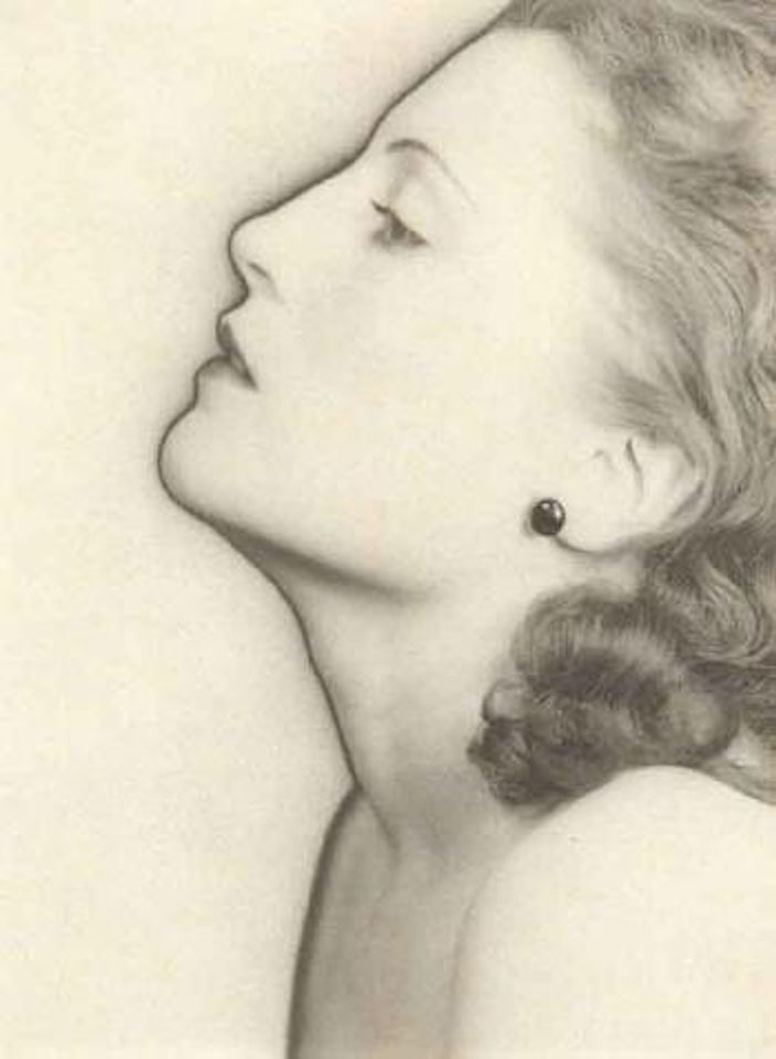Female profile, solarized, with black pearl earring by Man Ray