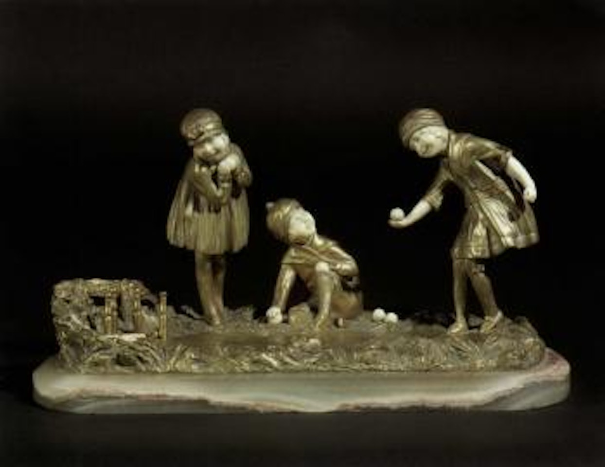Children playing skittles by Demetre Chiparus