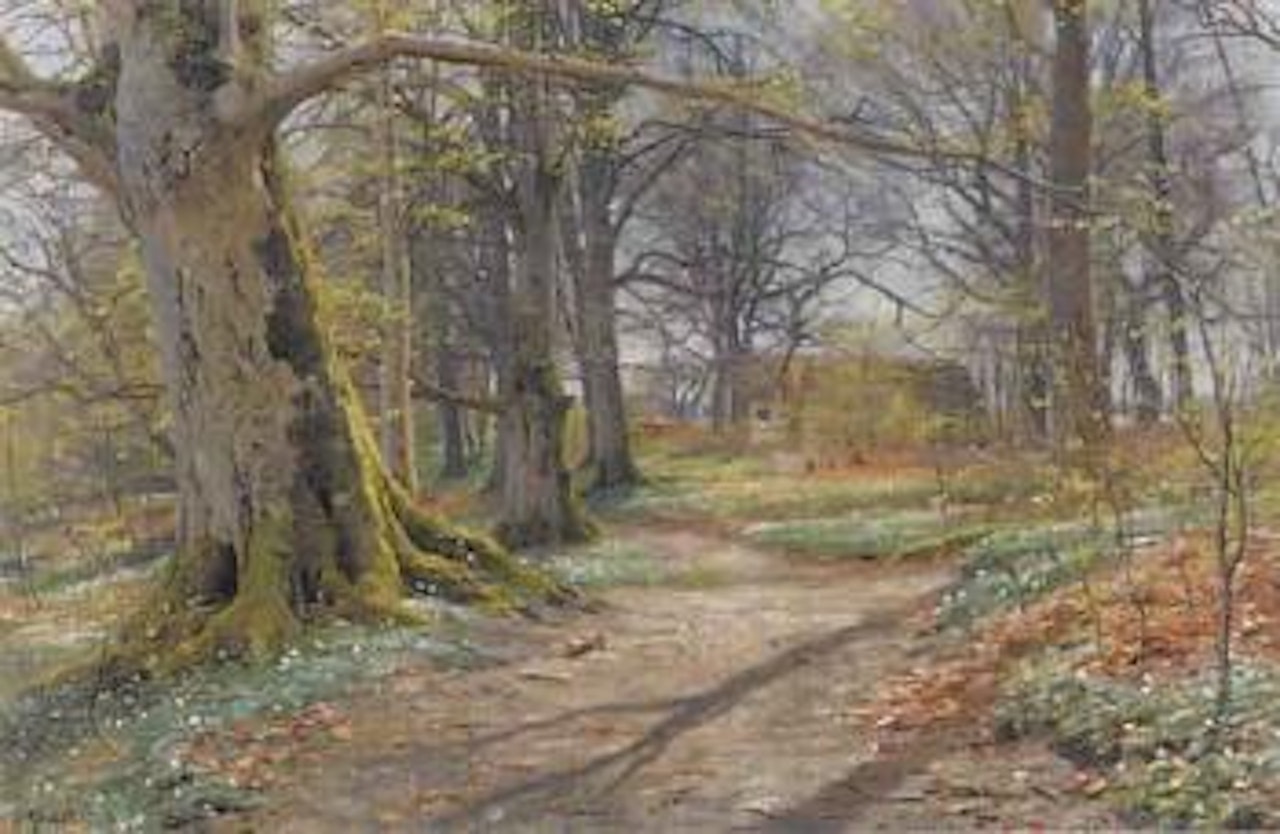 Wooded landscape in spring by Peder Mork Monsted