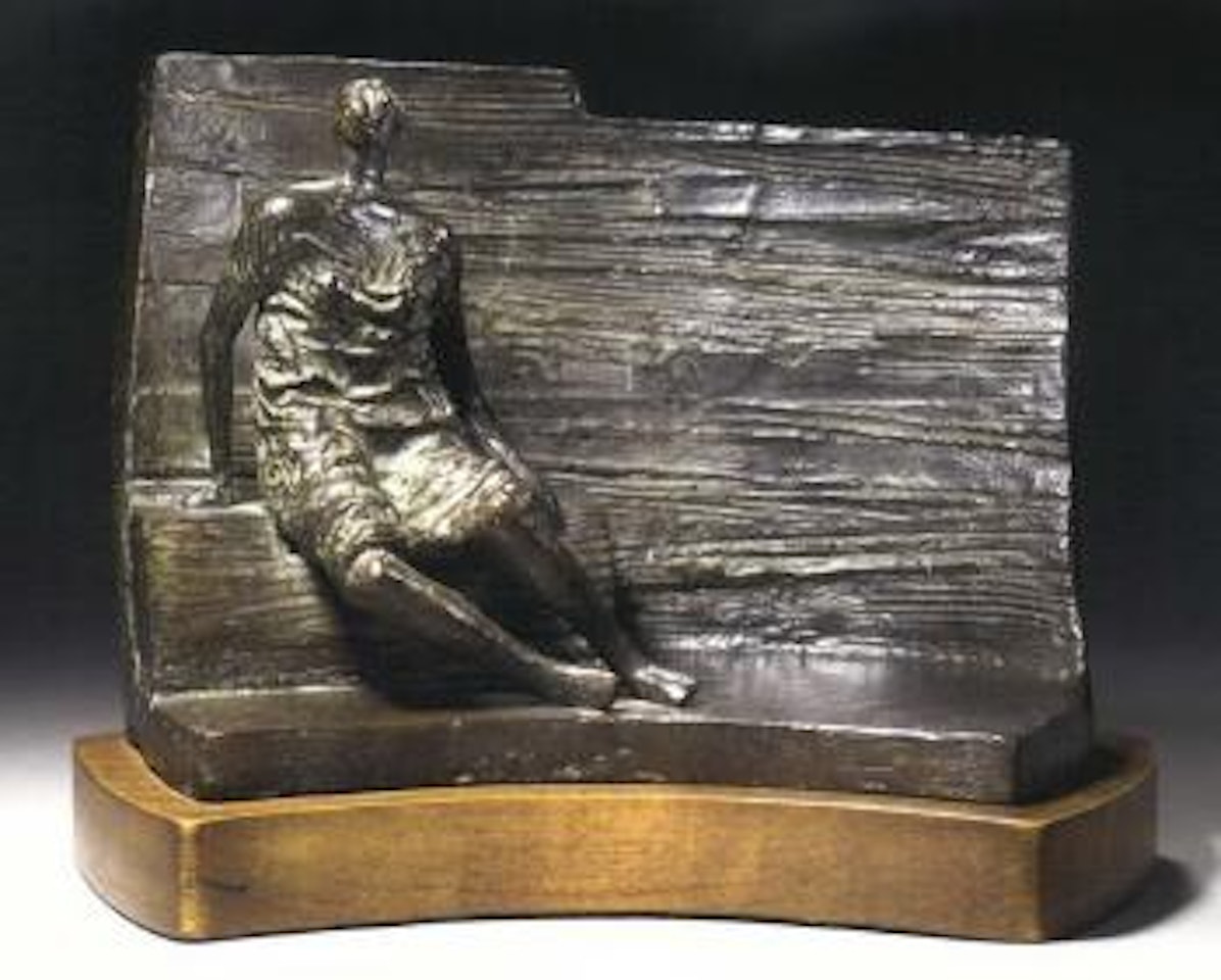 Draped seated figure against curved wall by Henry Moore