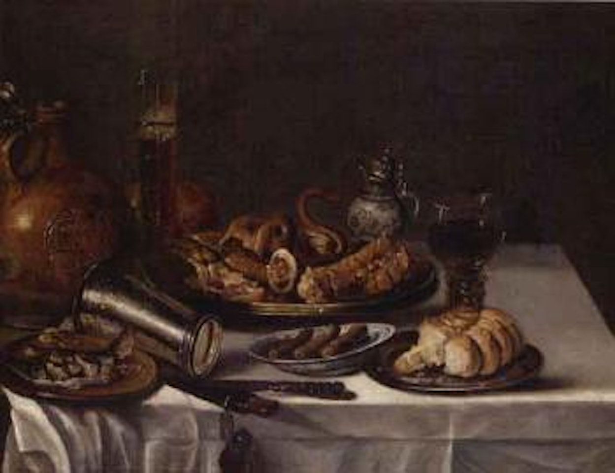 Still life of wineglass, bread and fish by Willem Claesz Heda