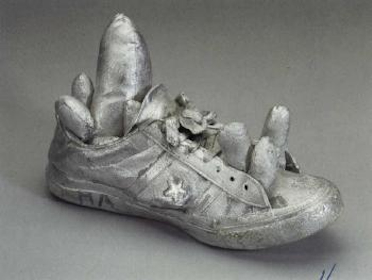 Silver shoe by Yayoi Kusama