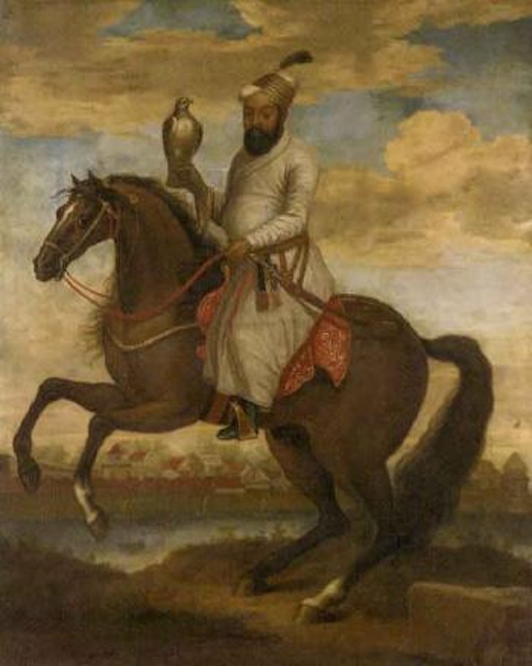 Equestrian portrait of an Indian nobleman in a white tunic, holding a hawk on his right hand by English School