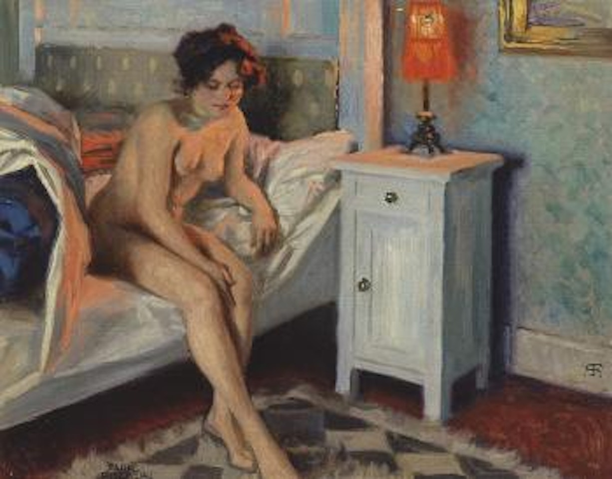 Model seated on bed in light of red table-lamp by Paul Fischer