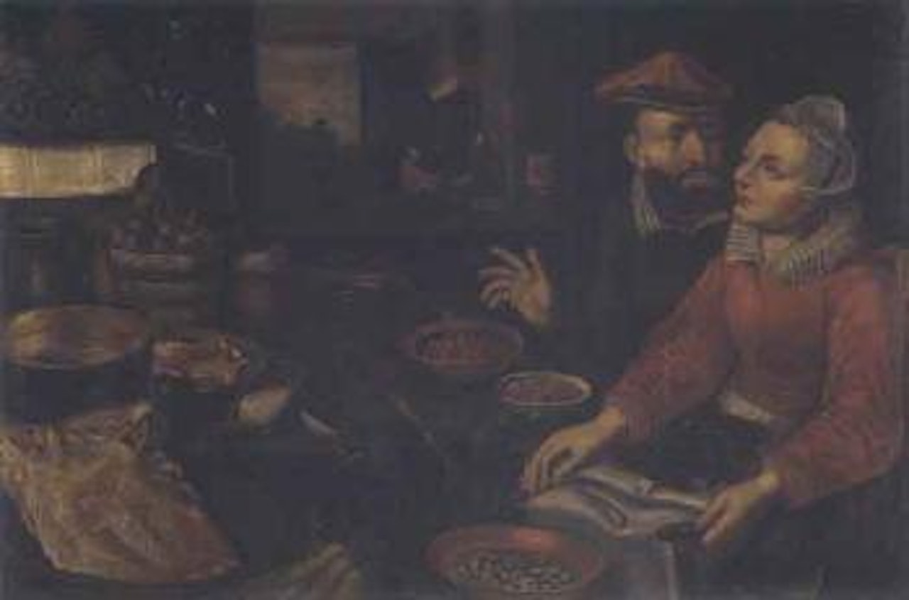 Man and woman at a table richly furnished by Flemish School