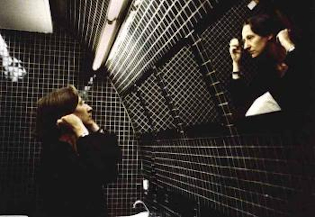 Suzanne in the green bathroom by Nan Goldin