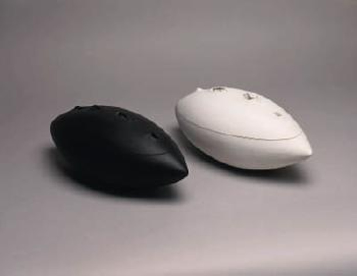 Concetto spaziale, white. Concetto spaziale, black by Lucio Fontana