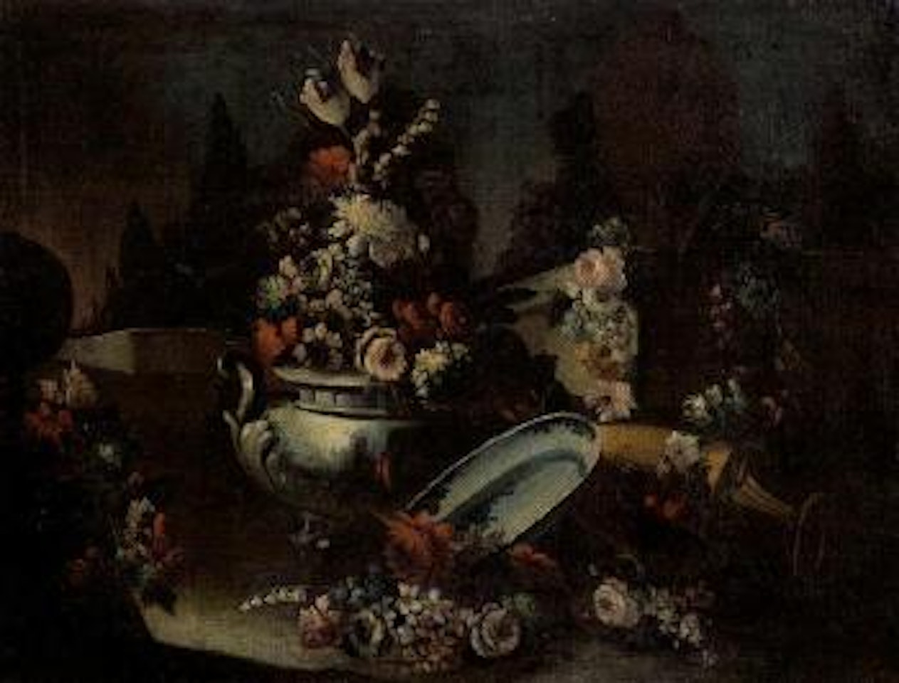 Still life of flowers, vases and ornamental plates, park landscape beyond by Italian School