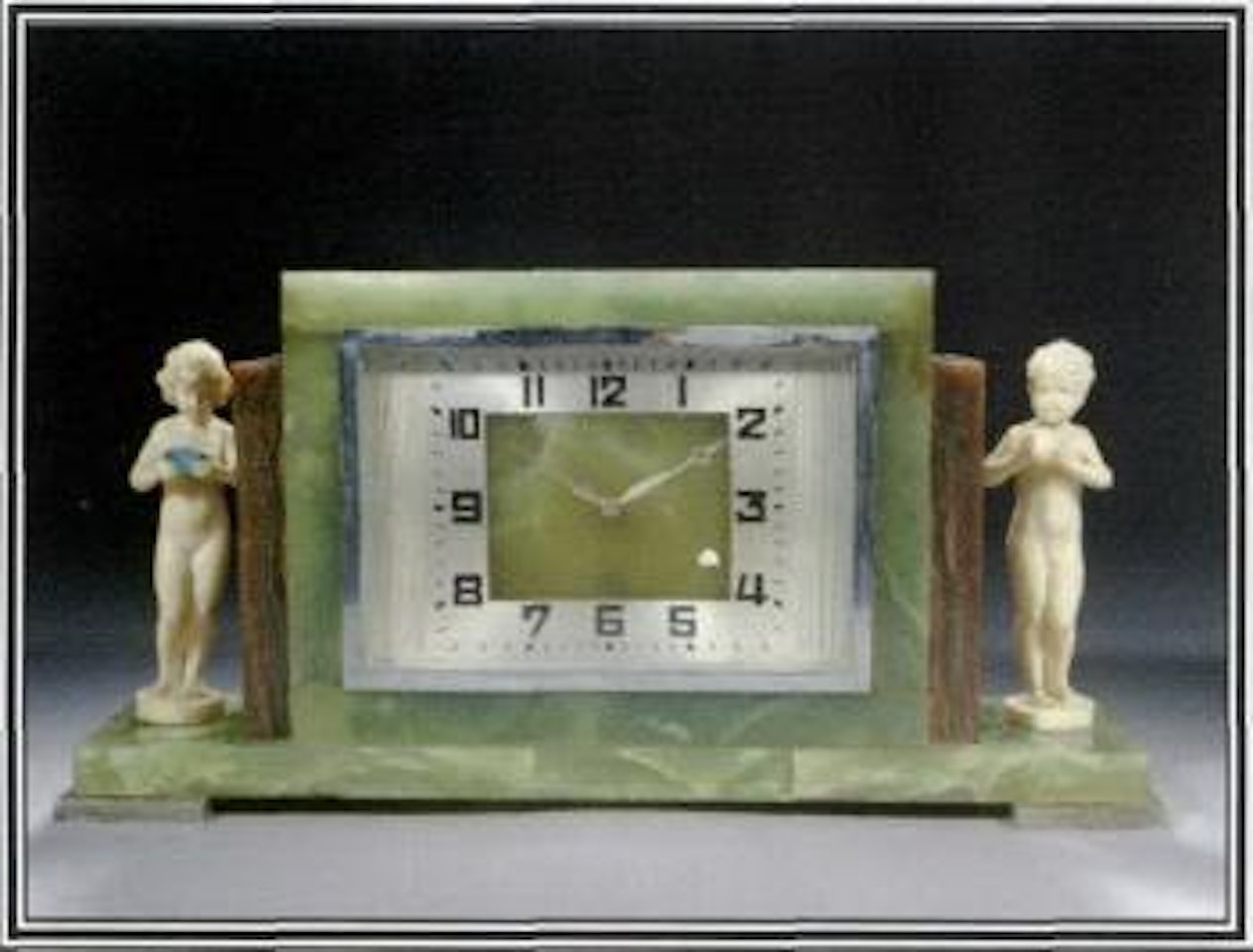 Mantle clock with naked boy and girl at each side by Ferdinand Preiss