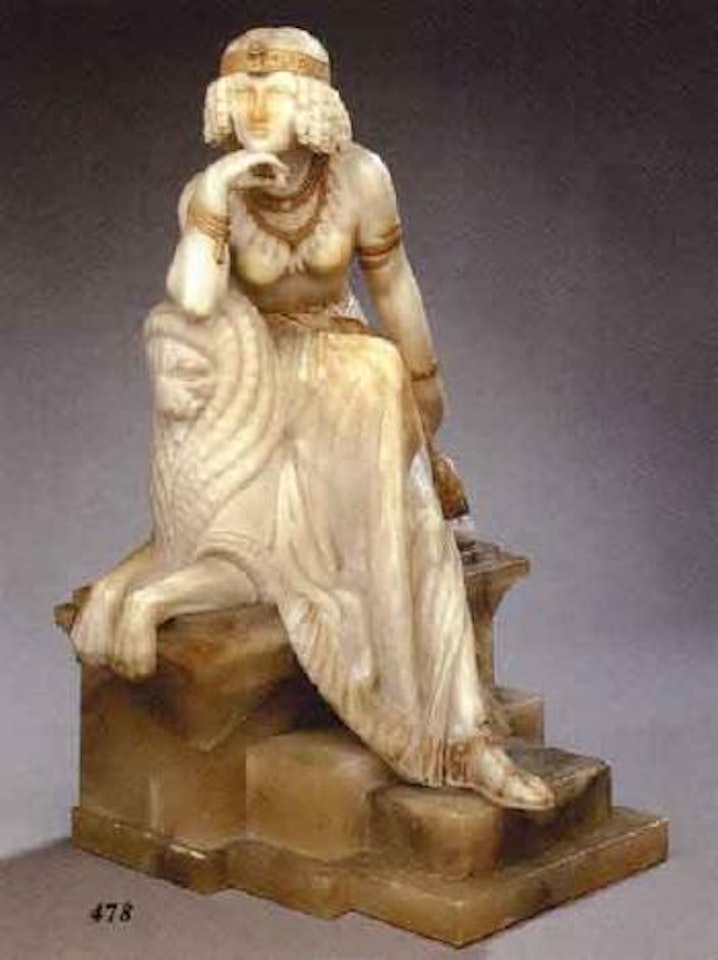 Figure of a lady with African headress seated on a recumbent lion by Italian School