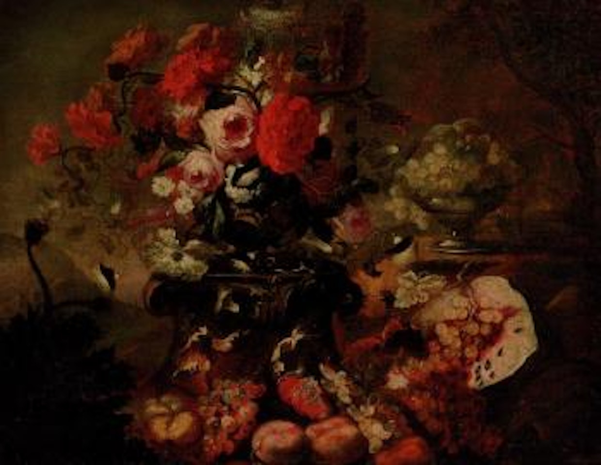 Still life of mixed flowers in an urn with fruit and a bowl of grapes by Michele Pace del Campidoglio