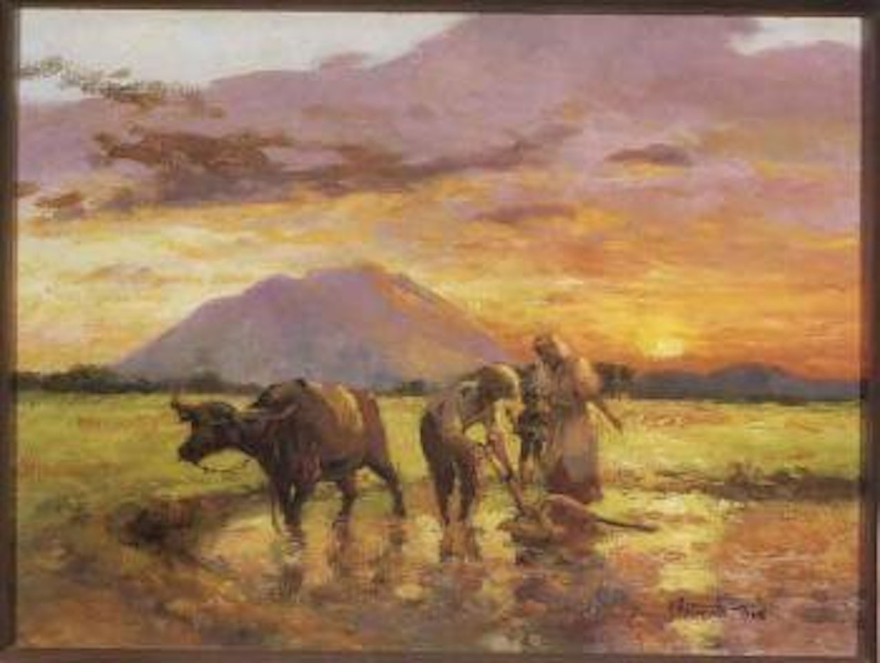 Landscape at sunset with figures and ox harvesting rice in the foreground by Fernando Amorsolo