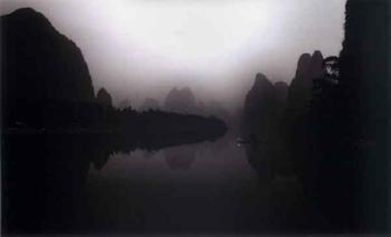 Fisherman on Li Jiang River at dawn by Russel Wong