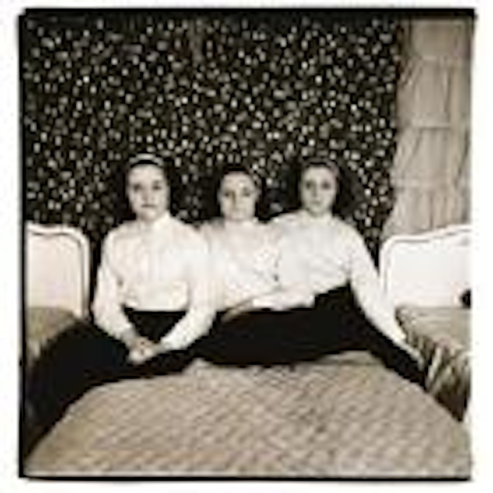 Triplets in their bedroom, New Jersey by Diane Arbus