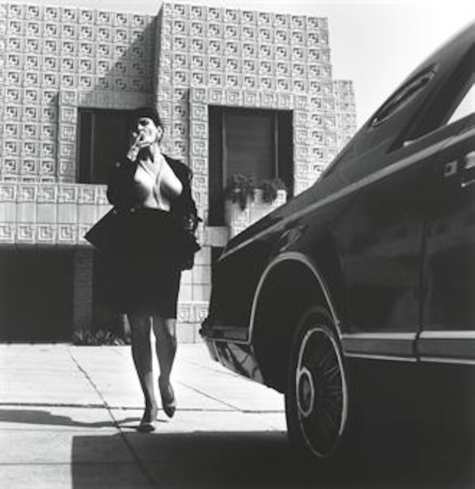 Woman in Chanel Suit, Smoking, Walking, Frank Lloyd Wright House in Background by Helmut Newton