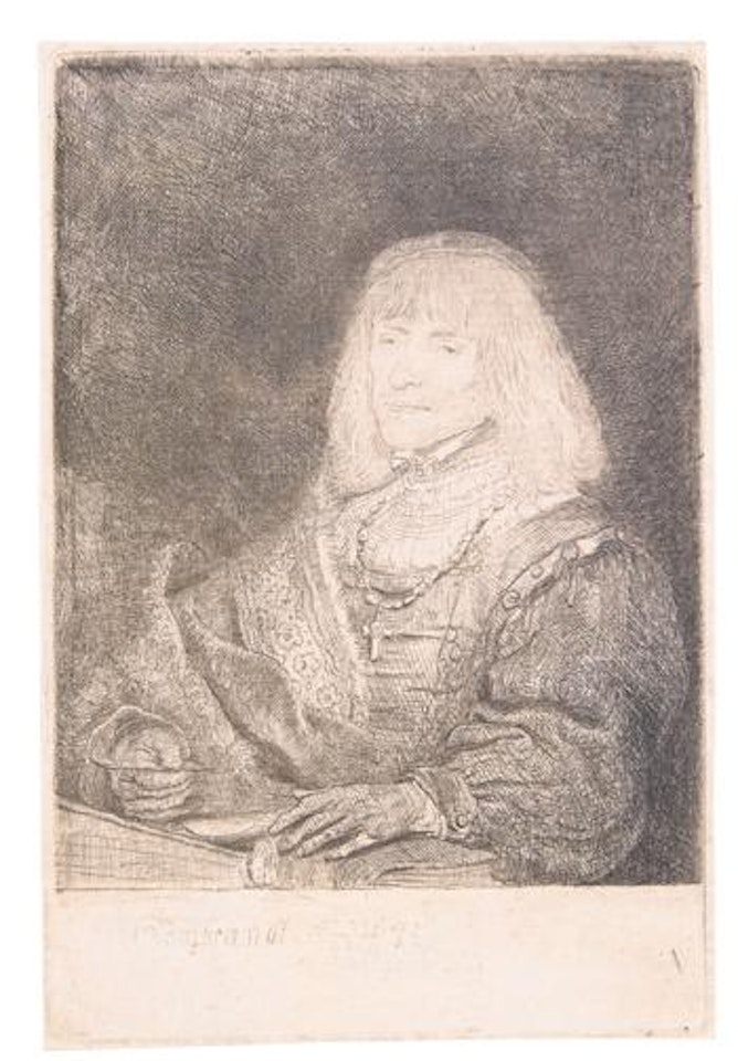 Man at a desk wearing a cross and a chain by Attributed to Rembrandt Harmensz van Rijn