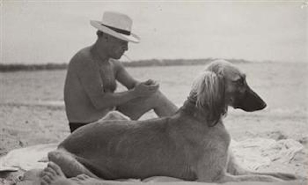 Pablo Picasso and his dog by Man Ray