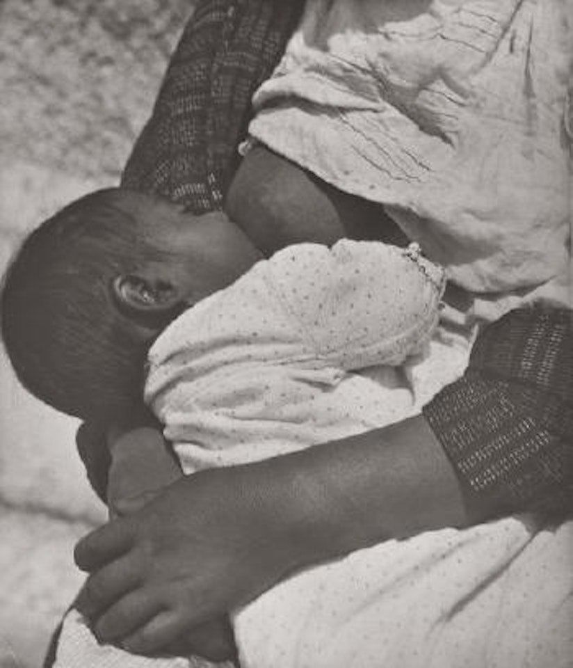 Baby suckling mother by Tina Modotti