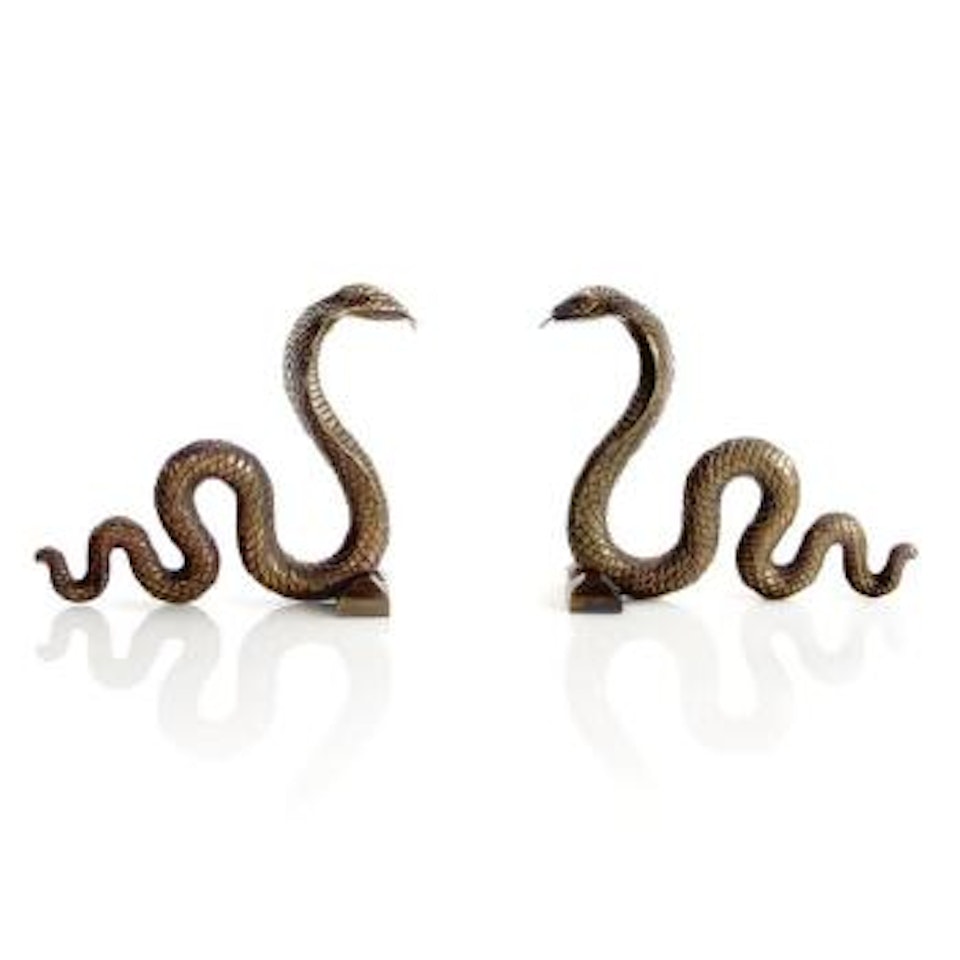 A Pair Of Serpent Andirons by Edgar Brandt