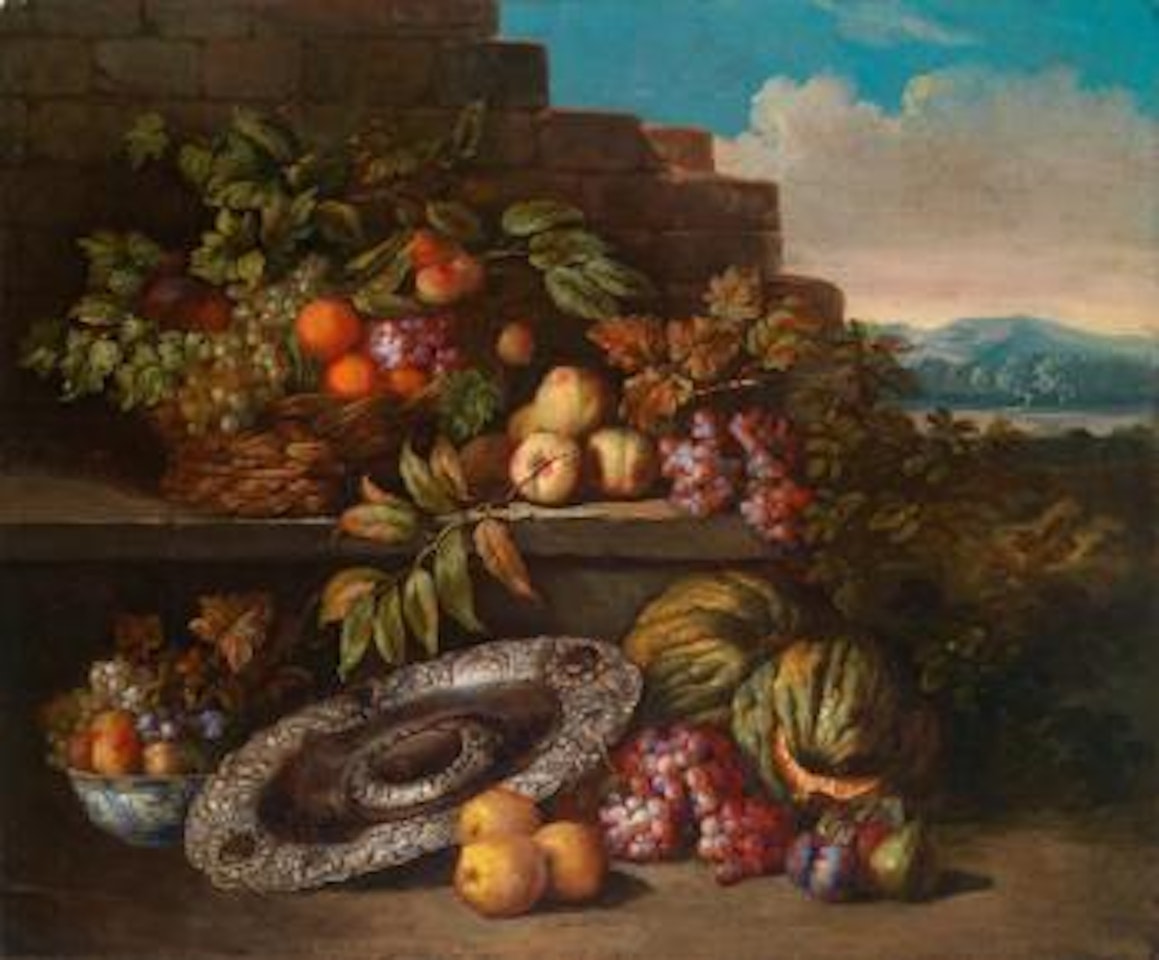 A still life with fruit and a decorated silver bowl on a base in a broad landscape by Jan Pauwel Gillemans