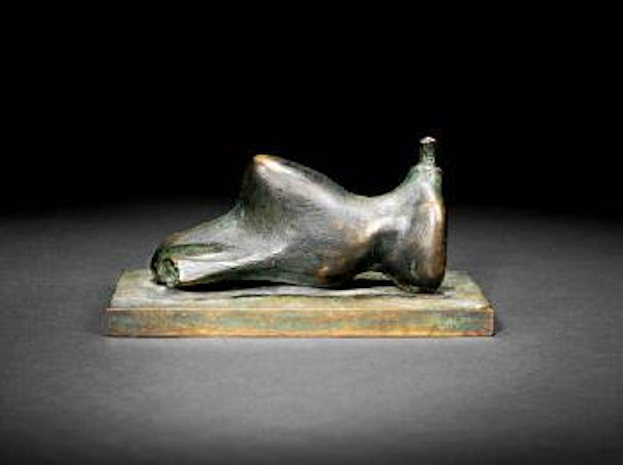 Reclining figure: small head by Henry Moore
