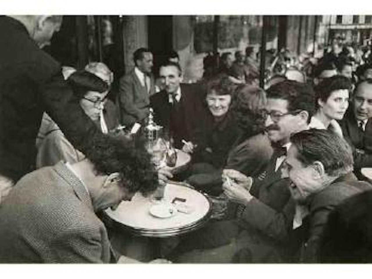 Giacometti, Hayter et Tapié à la terrasse des Deux Magots by Arnold Newman