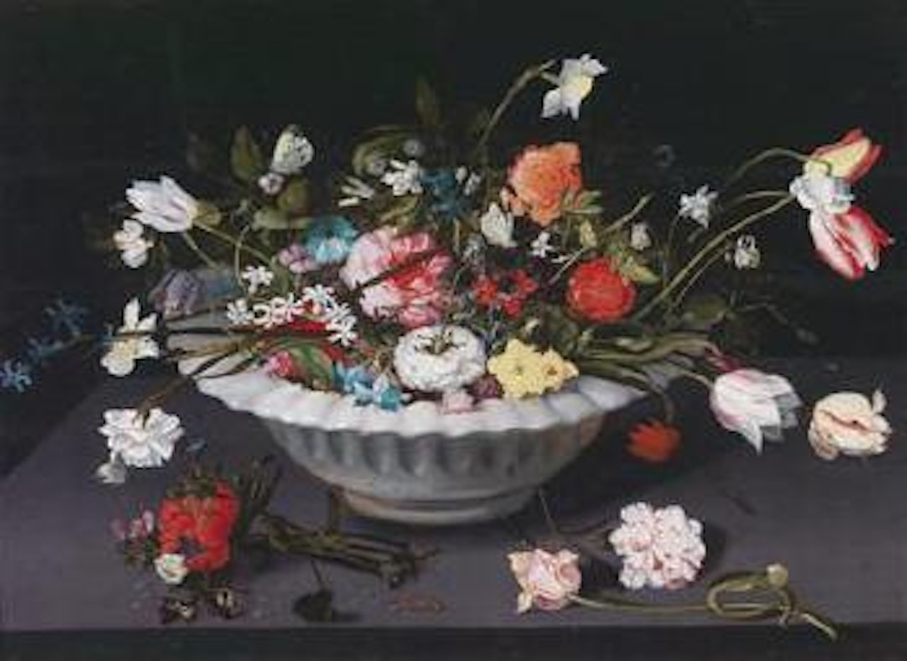 A still life of flowers in an earthenware dish on a table by Jan Brueghel the Younger