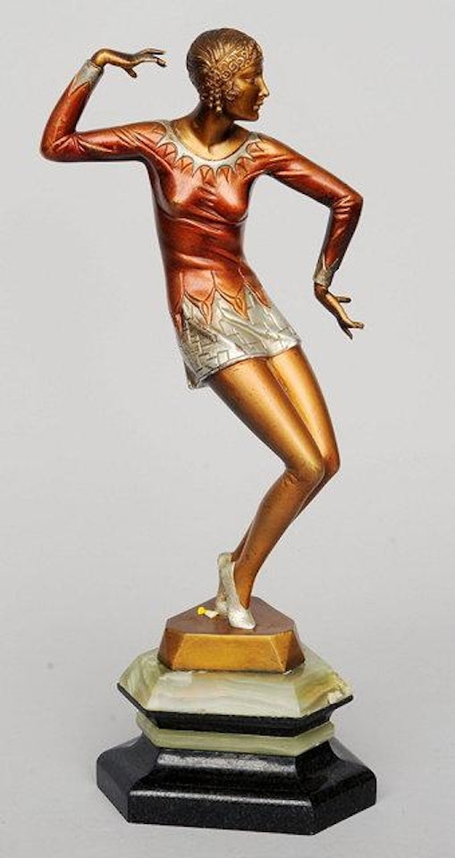 An exotic dancer, in colorful dress by Ferdinand Preiss
