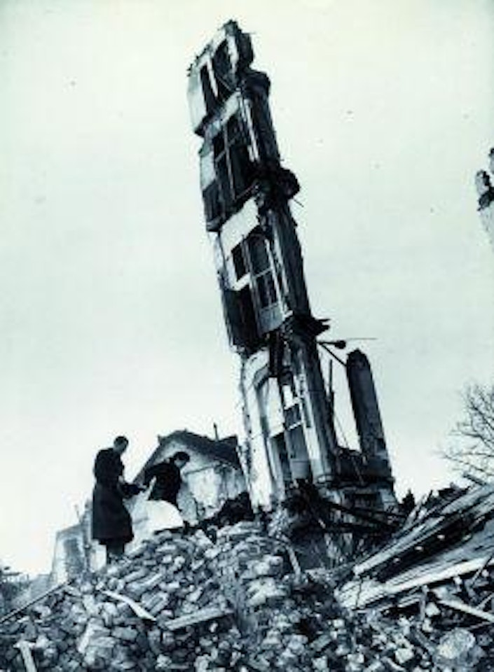 German civilian couple threading their way through the massive destruction from the city's bombing by the Allied Forces by Margaret Bourke-White