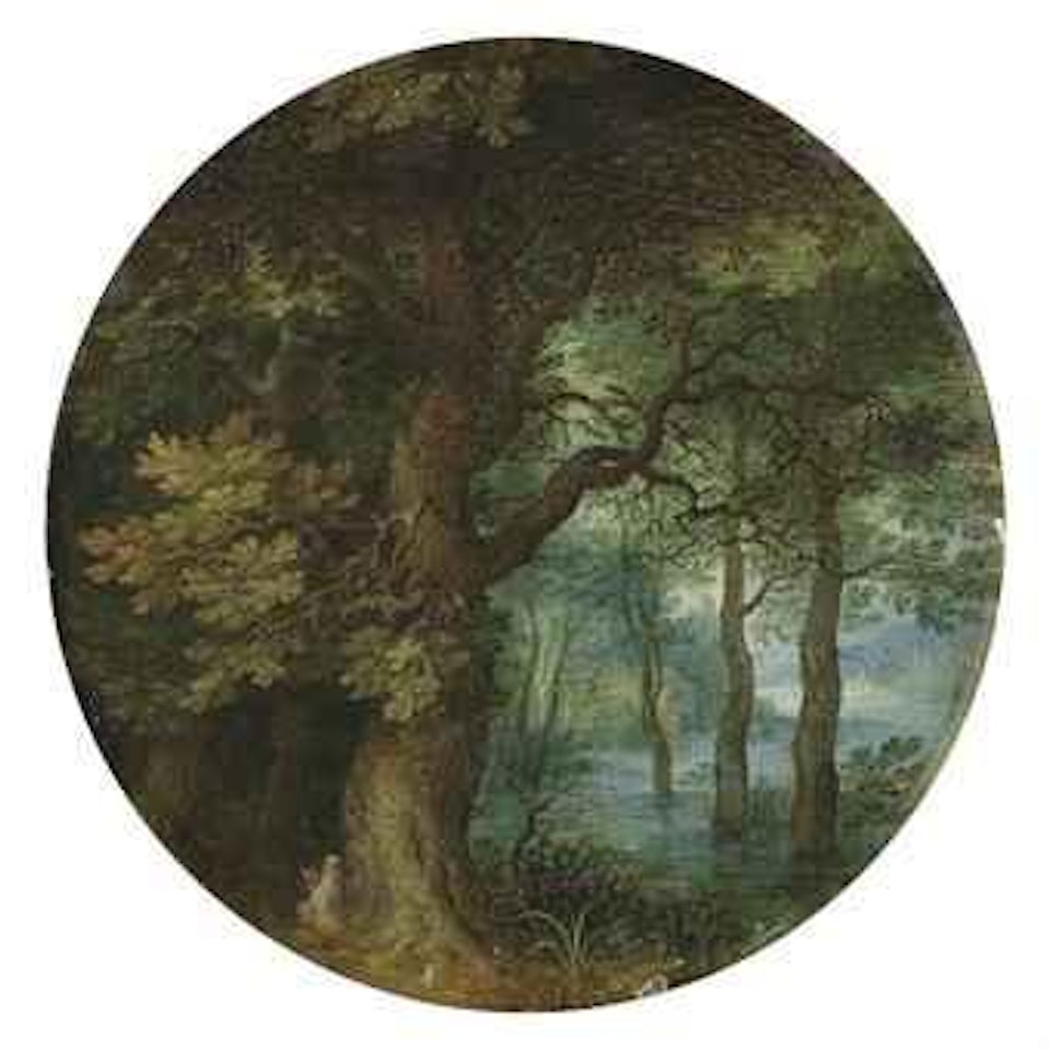 A wooded landscape with a hermit monk by Jan Brueghel the Younger